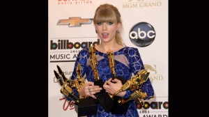 Taylor Swift poses in the press room with presented Billboard awards during the 2013 Billboard Music Awards at the MGM Grand Garden Arena on May 19, 2013 in Las Vegas, Nevada.   Jason Merritt/Getty Images/AFP