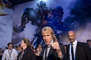 In this June 23, 2014 file photo, director Michael Bay, center, gestures to fans as he attends the premiere of movie "Transformers: Age of Extinction" at a theatre in Beijing, China. The movie is nominated for a Razzie award. The 35th annual Golden Raspberry (Razzie) Awards, ceremonies are held on Saturday, Feb. 21, 2015, at the Montalban Theatre in Los Angeles. AP