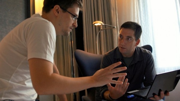 In this image released by Radius TWC, Edward Snowden, left, appears with Glenn Greenwald in a scene from "Citizenfour," a documentary that intimately captures  Snowden during his leak of NSA documents. The film is nominated for an Oscar for documentary feature. The Academy of Motion Picture Arts and Sciences honors the documentary nominees Wednesday, Feb. 18, 2015, ahead of the 87th annual Academy Awards, in Los Angeles. (AP Photo/Radius TWC)