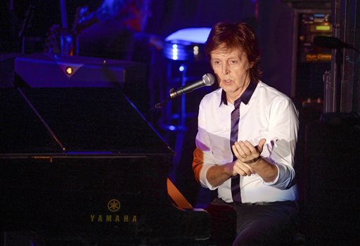 Paul McCartney and his band perform a secret Valentine's Day concert at Irving Plaza on Saturday, Feb. 14, 2015, in New York. AP
