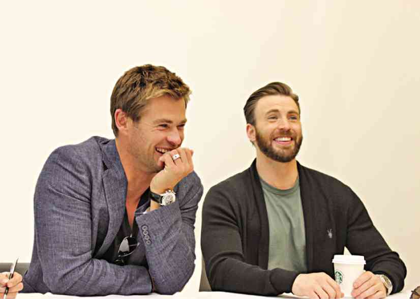 CHRIS Hemsworth (left) says working on the set with Chris Evans was like being back in high school.RUBEN V. NEPALES
