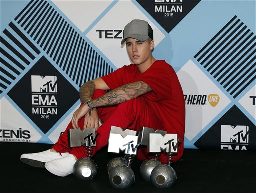 Justin Bieber pose for photographers with his awards during a photo call at the 2015 MTV European Music Awards in Milan, Italy, Sunday, Oct. 25, 2015. AP PHOTO