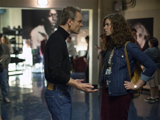 In this image released by Universal Pictures, Michael Fassbender, left, and Perla Haney-Jardine appear in a scene from, "Steve Jobs." (Francois Duhamel/Universal Pictures via AP)