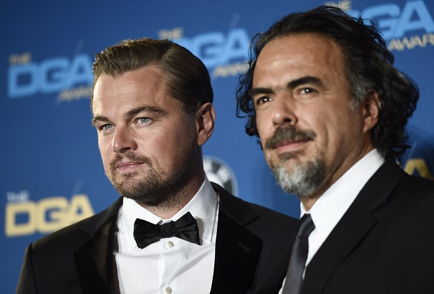 Leonardo DiCaprio, left, star of "The Revenant," poses backstage with the film's director Alejandro Gonzalez Inarritu at the 68th Directors Guild of America Awards at the Hyatt Regency Century Plaza on Saturday, Feb. 6, 2016 in Los Angeles. (Photo by Chris Pizzello/Invision/AP)