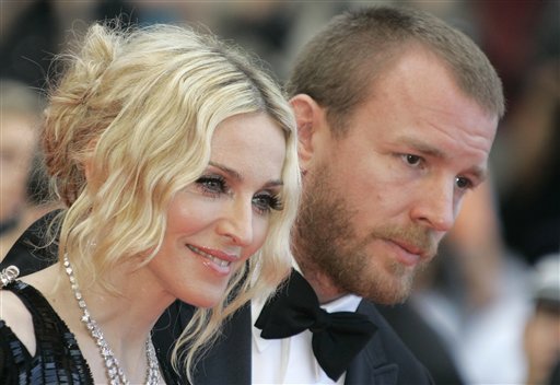 This is a  Wednesday, May 21, 2008 file photo of Madonna and  her then husband director Guy Ritchie as they arrive for the premiere of the film "I Am Because We Are" at the 61st international Cannes film festival, in Cannes France. A British judge is analyzing legal issues stemming from a dispute between Madonna and her ex-husband Guy Ritchie over custody of their 15-year-old son Rocco.  Judge Alistair MacDonald said Thursday March 10, 2016 the fact that case is being analyzed can be reported but that no further details can be published. (AP Photo/Lionel Cironneau)