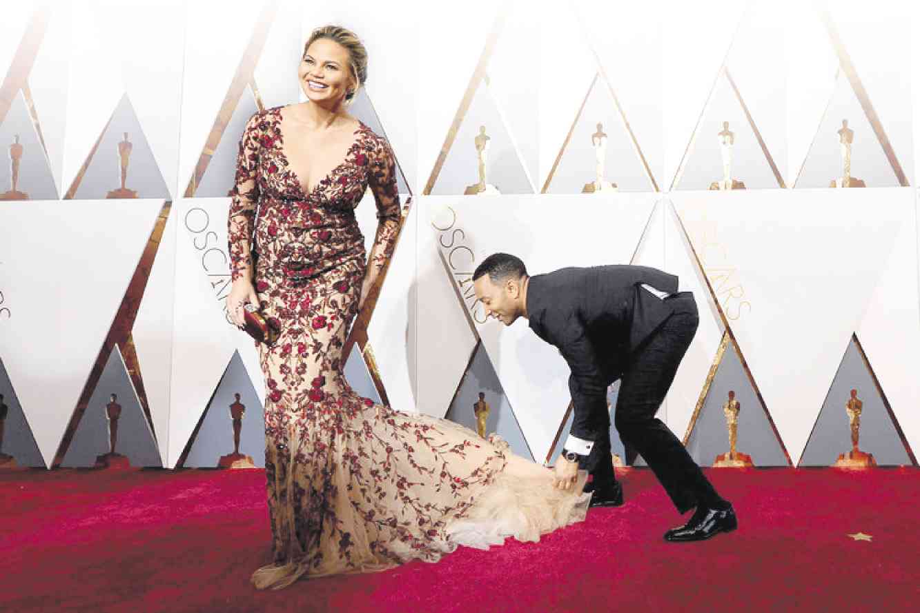 JOHN with wife Chrissy Teigen at the recent Oscars              Contributed photo