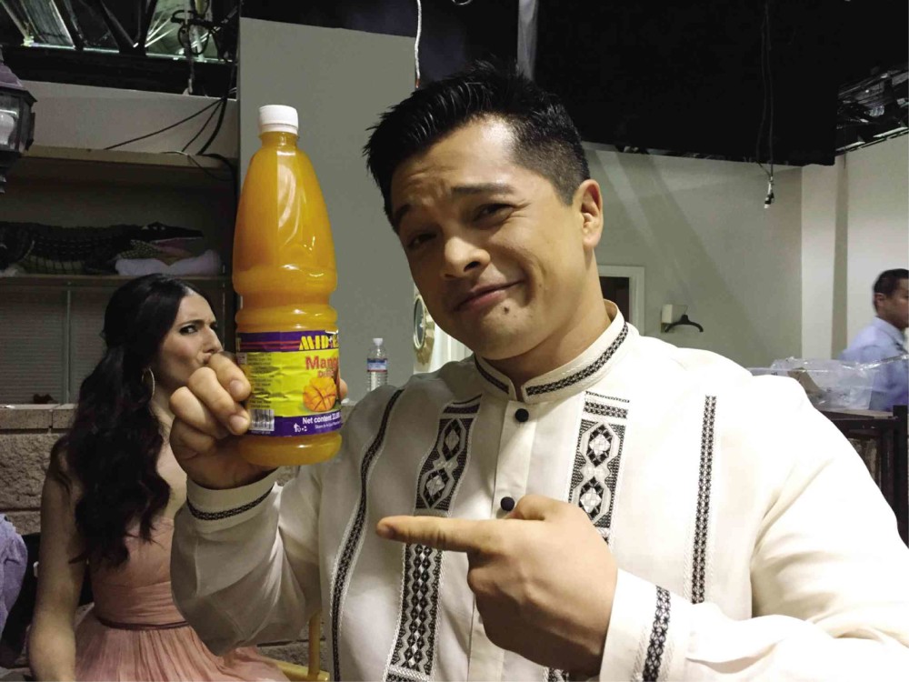 VINCENT Rodriguez III, in a “barong,” brought mango juice to the set.