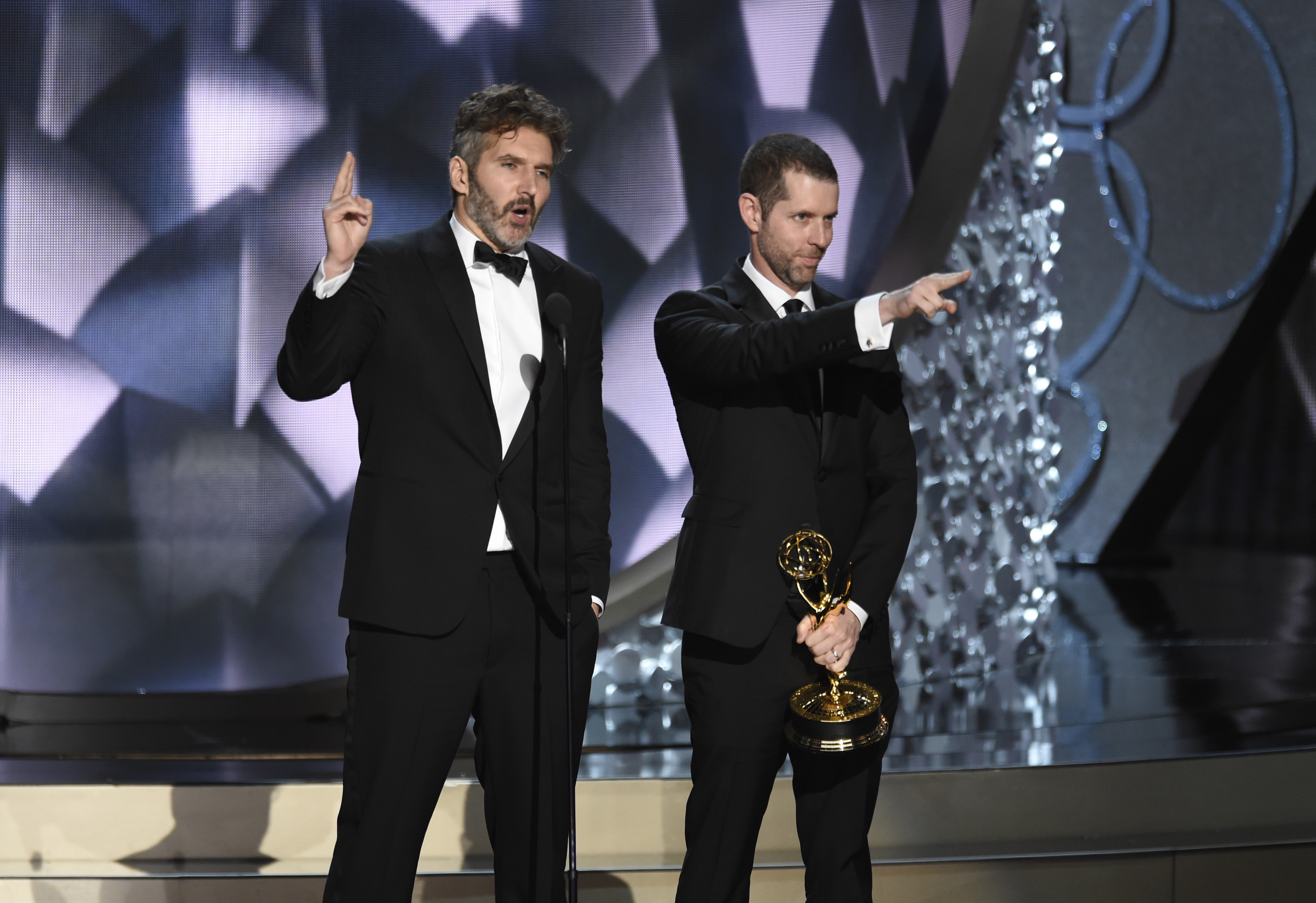 David Benioff, left, and D.B Weiss accept the award for outstanding writing for a drama series for Game of Thrones at the 68th Primetime Emmy Awards on Sunday, Sept. 18, 2016, at the Microsoft Theater in Los Angeles. (Photo by Chris Pizzello/Invision/AP)