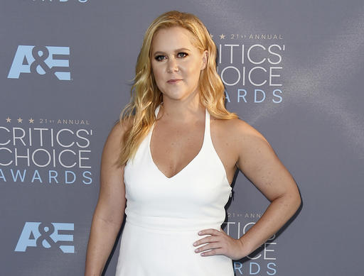 In this Jan. 17, 2016 file photo, Amy Schumer arrives at the 21st annual Critics' Choice Awards in Santa Monica, Calif. Schumer says in an essay published Friday, Oct. 28, that her “Formation” video, which shows her singing and dancing to the Beyoncé song alongside Goldie Hawn, Wanda Sykes and Joan Cusack, is not a parody, but a tribute approved by Beyoncé and Jay Z. AP