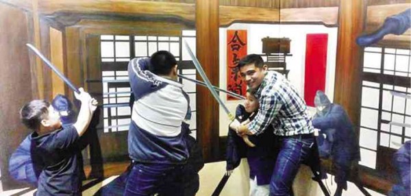 MARVIN Agustin (right) crosses toy swords with young diners at his restaurant. 