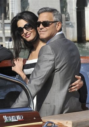  George Clooney and his fiancee Amal Alamuddin arrive in Venice, Italy, Friday, Sept. 26, 2014. AP 