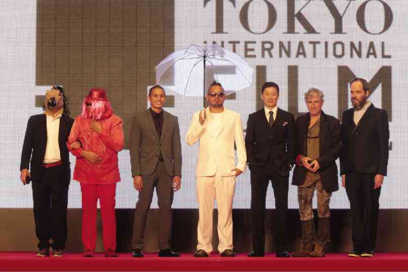ON THE RED carpet (from left): Marcello Bussi (with the “tikbalang” mask), Vim Nadera, Andre Puertollano, Khavn, Tadanobu Asano, Christopher Doyle  and Stephan Holl. TIFF 2014