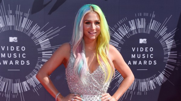 In this Ag. 24, 2014 file photo, Kesha arrives at the MTV Video Music Awards at The Forum in Inglewood, Calif. Kesha and her mentor and music producer, Dr. Luke, filed dueling lawsuits on Tuesday, Oct. 14, 2014, over the pop singer's recording contracts and her allegations that the producer sexually and emotionally abused her for several years. Dr. Luke's lawsuit calls the claims an extortion attempt by Kesha and her mother to gain a more favorable recording contract. (Photo by Jordan Strauss/Invision/AP, file)
