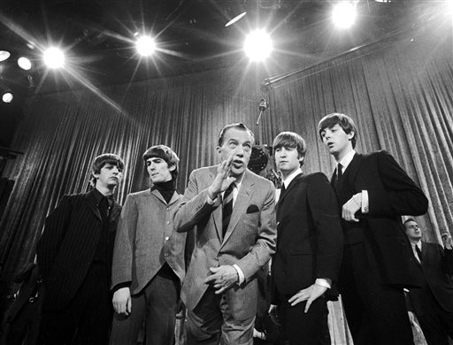 In this Feb. 8, 1964 file photo, Ed Sullivan, center, stands with The Beatles, from left, Ringo Starr, George Harrison, John Lennon and Paul McCartney, during a rehearsal for the British group's first American appearance on "The Ed Sullivan Show," in New York. AP