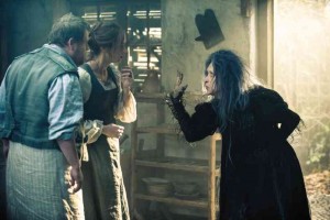 MERYL (right) as The Witch puts a curse on James Corden and Emily Blunt, as The Baker and The Baker’s Wife. 