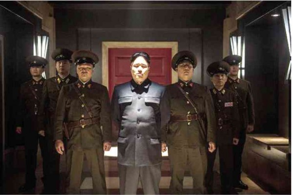 RANDALL Park (center) as North Korean despot Kim Jong-un “The Interview” 