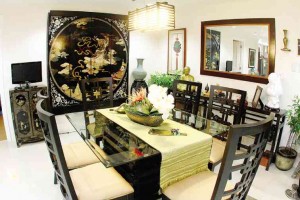 Six-seater dining set was custom-made; Oriental wall piece and buffet cabinet were bought in China.