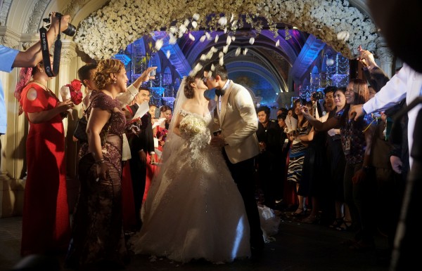 Flower petals are thrown at the couple. INQUIRER PHOTO / GRIG C. MONTEGRANDE