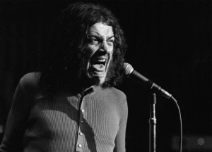In this June 1970 photo released by Linda Wolf, British singer Joe Cocker performs during the Joe Cocker - Mad Dogs & Englishmen tour and traveling party. Cocker, the raspy-voiced British singer known for his frenzied cover of "With a Little Help From My Friends," and the teary ballad "You Are So Beautiful," died of lung cancer on, Monday, Dec. 22, 2014 in Colorado. He was 70.  AP