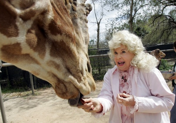 FILE - In this March 4, 2009 file photo, Donna Douglas, who starred in the television series "The Beverly Hillbillies" tours the Audubon Zoo in New Orleans. Douglas, who played the buxom tomboy Elly May Clampett on the hit 1960s sitcom has died. Douglas, who was 82, died Thursday, Jan. 1, 2015, in Baton Rouge, where she lived, her niece, Charlene Smith, said. AP