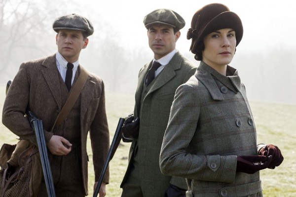 This photo provided by PBS/Masterpiece shows, from left, Allen Leech as Tom Branson, Tom Cullen as Lord Gillingham, and Michelle Dockery as Lady Mary, in a scene from season 5 of "Downton Abbey." The show premieres Sunday, Jan. 4, 2015 on Masterpiece on PBS.  AP
