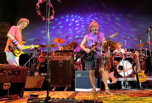 FILE - In this Aug. 3, 2002 file photo, The Grateful Dead, from left, Phil Lesh, Bill Kreutzmann, Bob Weir and Mickey Hart perform during a reunion concert in East Troy, Wis. he band announced Friday that original members Mickey Hart, Bill Kreutzmann, Phil Lesh and Bob Weir will perform three shows from July 3-5 at Soldier Field in Chicago. (AP Photo/Morry Gash, File)