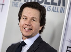 In this Nov. 10, 2014, file photo, Mark Wahlberg arrives at the 2014 AFI Fest - "The Gambler," in Los Angeles. Wahlberg asked Massachusetts for a pardon for assaults he committed in 1988 when he was a teenager in Boston. Wahlberg’s application with the Massachusetts Parole Board said he isn’t the same person he was 26 years ago and his past convictions are still affecting his life. Victims of one of Mark Wahlberg’s racially motivated attacks as a teenage delinquent in segregated 1980s Boston are divided over whether the actor should get the pardon he’s seeking. AP