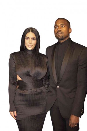 KIM KARDASHIAN (left) and husband Kanye West appear in the popular series “Keeping Up With the Kardashians.”  AP