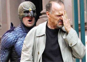 Riggan Thomson (Michael Keaton, right) is bugged by his former film persona Birdman (Benjamin Kanes).