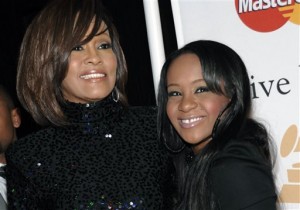 In this Feb. 12, 2011, file photo, singer Whitney Houston, left, and daughter Bobbi Kristina Brown arrive at an event in Beverly Hills, Calif. AP 