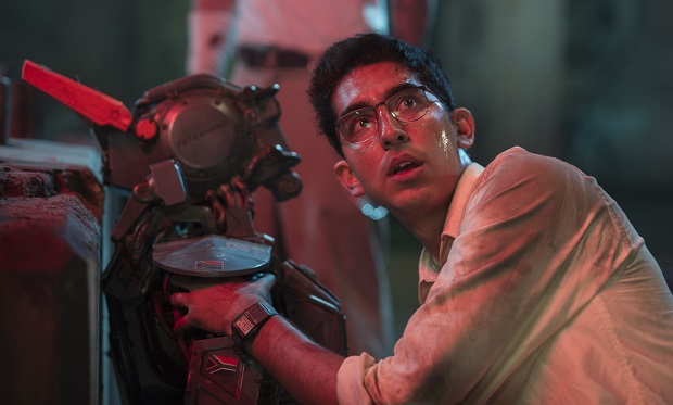 This image released by Columbia Pictures shows Dev Patel in a scene from "Chappie." (AP Photo/Columbia Pictures, Stephanie Blomkamp)
