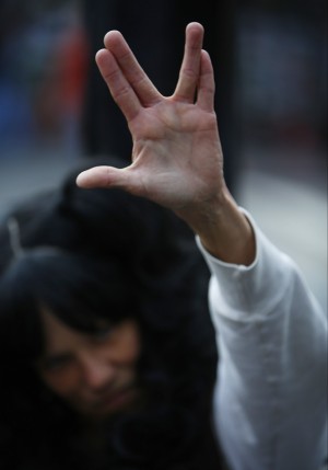 An unidentified fan gives a salute in honor of Leonard Nimoy at his star on the Hollywood Walk of Fame  in Los Angeles Friday, Feb. 27, 2015. Nimoy, famous for playing officer Mr. Spock in Star Trek died Friday, Feb. 27, 2015 in Los Angeles of end-stage chronic obstructive pulmonary disease. He was 83. (AP Photo/Damian Dovarganes)