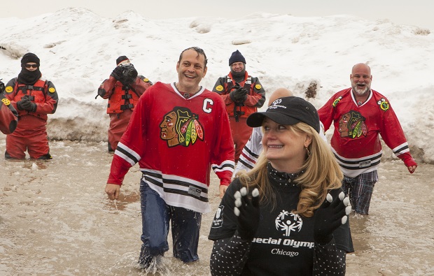 Actor Vince Vaughn, center left, and Special Olympics Chicago President Casey Hogan take part in the Chicago Polar Plunge at North Avenue Beach on Sunday, March 1, 2015 in Chicago. (Photo by Barry Brecheisen/Invision/AP)
