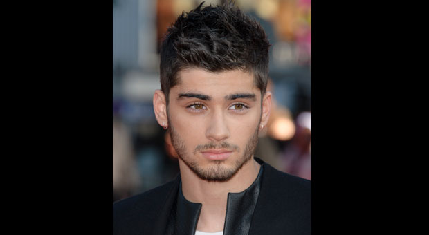 Zayn Malik flies home from One Direction tour with stress in this Tuesday, Aug. 20, 2013 file photo Zayn Malik arrives for the UK Premiere of 'One Direction: This Is Us 3D' at a central London cinema. AP