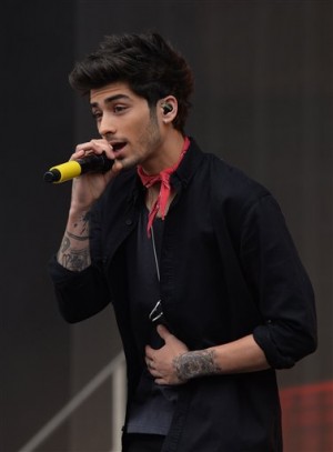 FILE - In this May 24, 2014 file photo, Zayn Malik of boy band One Direction sings during a performance, in Glasgow, Scotland. Chart-topping boy band One Direction says Zayn Malik has left the group. The band confirmed his departure Wednesday, March 25, 2015 in a statement.AP PHOTO UNITED KINGDOM OUT
