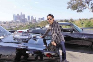 JAMES Wan on the parking lot of LA’s Dodger Stadium, where the franchise’s exotic cars are on display. He tells the Inquirer, “From a practical filmmaking standpoint... I never questioned our ability to finish it (after Walker’s death). The hardest part was getting around the emotion.”RUBEN V. NEPALES