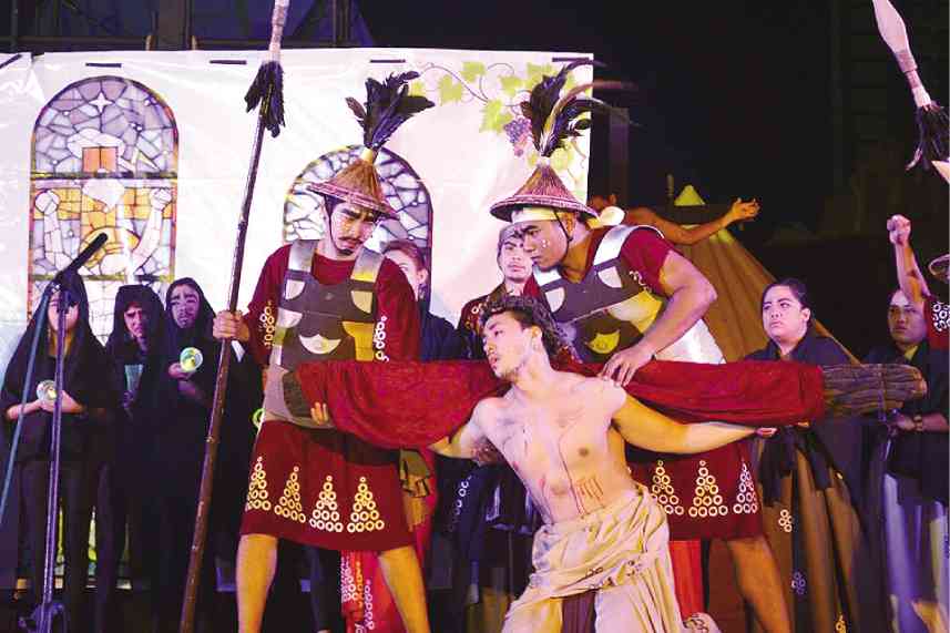 LANCE Raymundo (center) plays Jesus Christ in the play.