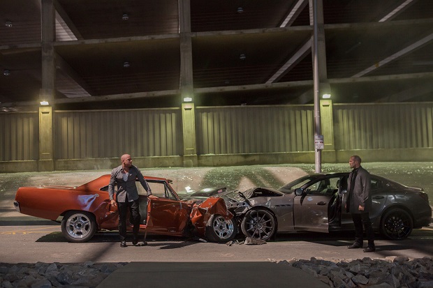FILE - This file photo provided by Universal Pictures shows, Vin Diesel, left, as Dom Toretto, and Jason Statham, as Deckard Shaw, in a scene from "Furious 7." The high-octane thriller "Furious 7" maintained its pace in its second week, speeding away with $60.6 million at North American theaters, bringing its box-office total to a robust $252.5 million, according to studio estimates Sunday, April 12, 2015. (AP Photo/Universal Pictures, Scott Garfield, File)