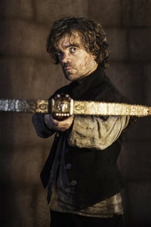 In this image released by HBO, Tyrion Lannister, portrayed by Peter Dinklage, appears in a scene from season four of "Game of Thrones." The season five premiere airs on Sunday. (AP Photo/HBO, Helen Sloan)