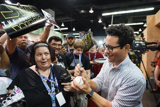 Filmmaker J.J. Abrams signs autographs for fans on the Cantina set at Star Wars Celebration: The Ultimate Fan Experience held at the Anaheim Convention Center on Thursday, April 16, 2015, in Anaheim, Calif. (Photo by Richard Shotwell/Invision/AP)