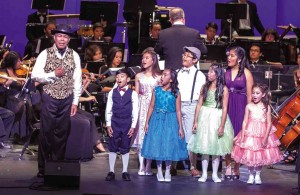 FIL-AM community leader Edwin Raquel (left) made his surprise stage debut with, from left (front row): Micah Luna, Christina Blay, Sabrina Evangelista and Maggi Avant; from left (back row): Tia Enroth, Christian Avendaño and Samantha Isidro   PHOTO BY Rick Gavino