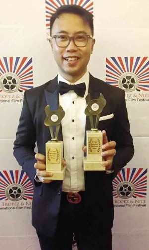 PERCI Intalan shows off two awards.  photo: facebook