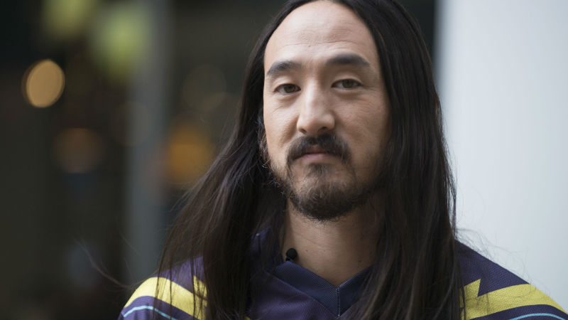 This Oct. 28, 2014 file photo shows, Steve Aoki on "The Morning Show," in Toronto. Aoki is undergoing surgery to repair his vocal chords. The 37-year-old electronic music artist says in video posted Thursday, May 14, 2015, on Facebook that he's canceling five performances in Europe to undergo the surgery. (Photo by Arthur Mola/Invision/AP, File)
