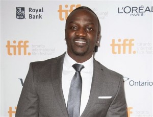  In this Sept. 11, 2014 file photo, singer Aliaune Thiam, better known as Akon, attends the premiere of "American Heist" at the Princess of Wales Theatre during the 2014 Toronto International Film Festival in Toronto. Akon, who was born in the U.S. of Senegalese parents and was reared in both countries, started an initiative called "Akon Lighting Africa" two years ago with a goal of bringing electricity to a million homes by the end of 2014. He told a U.N. news conference Wednesday, May 20, 2015, on promoting clean energy that the initiative not only achieved that but has spread to 14 African countries. AP FILE PHOTO