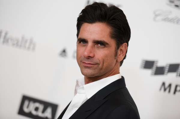 This April 25 file photo shows actor John Stamos arriving at the 4th Annual Reel Stories, Real Lives Benefit in Los Angeles. Stamos has been arrested and cited with driving under the influence in Beverly Hills. AP