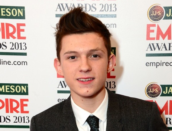 FILE - In this March 24, 2013 file photo, actor Tom Holland, winner of Best Male Newcomer Award appears at the Jameson Empire Film Awards 2013 in London. Sony Pictures and Marvel Studios announced Tuesday, June 23, 2015  that Holland will play Peter Parker/Spider-Man in the next "Spider-Man" film, in theaters in IMAX and 3D on July 28, 2017.  The film will be directed by Jon Watts. (Photo by Jon Furniss/Invision/AP, File)