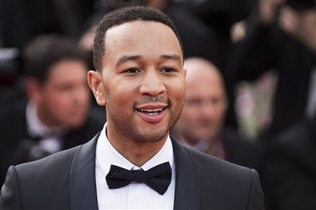 FILE - In this May 13, 2015 file photo, John Legend arrives for the opening ceremony and the screening of the film "La Tete Haute" (Standing Tall), at the 68th international film festival, Cannes, southern France. Legend is bringing his talents to a TV drama about Southern slaves fighting for freedom. WGN America said Wednesday, July 29, 2015, that Legend and his production company will be in charge of the score and soundtrack for "Underground."  (Photo by Arthur Mola/Invision/AP, File)