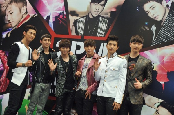 Ok Taek-yeon (L), Nichkhun Horvejkul (2nd L), Lee Jun-ho (C-L), Kim Junsu (C-R), Jang Wooyoung (2nd R) and Hwang Chansung (R) of the South Korean boy band 2PM pose for a picture during a press conference in Hong Kong on March 9, 2012. 2PM, whose members are known for their muscular bodies, will hold their first concert in Hong Kong on March 10, 2012. AFP PHOTO 