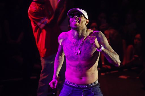 Grammy award-winning singer Chris Brown performs at a club in Macau, early Saturday, July 25, 2015. Brown left the Philippines and arrived in Macau after a three-day delay due to a fraud complaint against him for a canceled concert last New Year's Eve. AP PHOTO