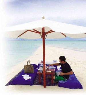 PAUL Soriano prepares a picnic for two on a sand bar.